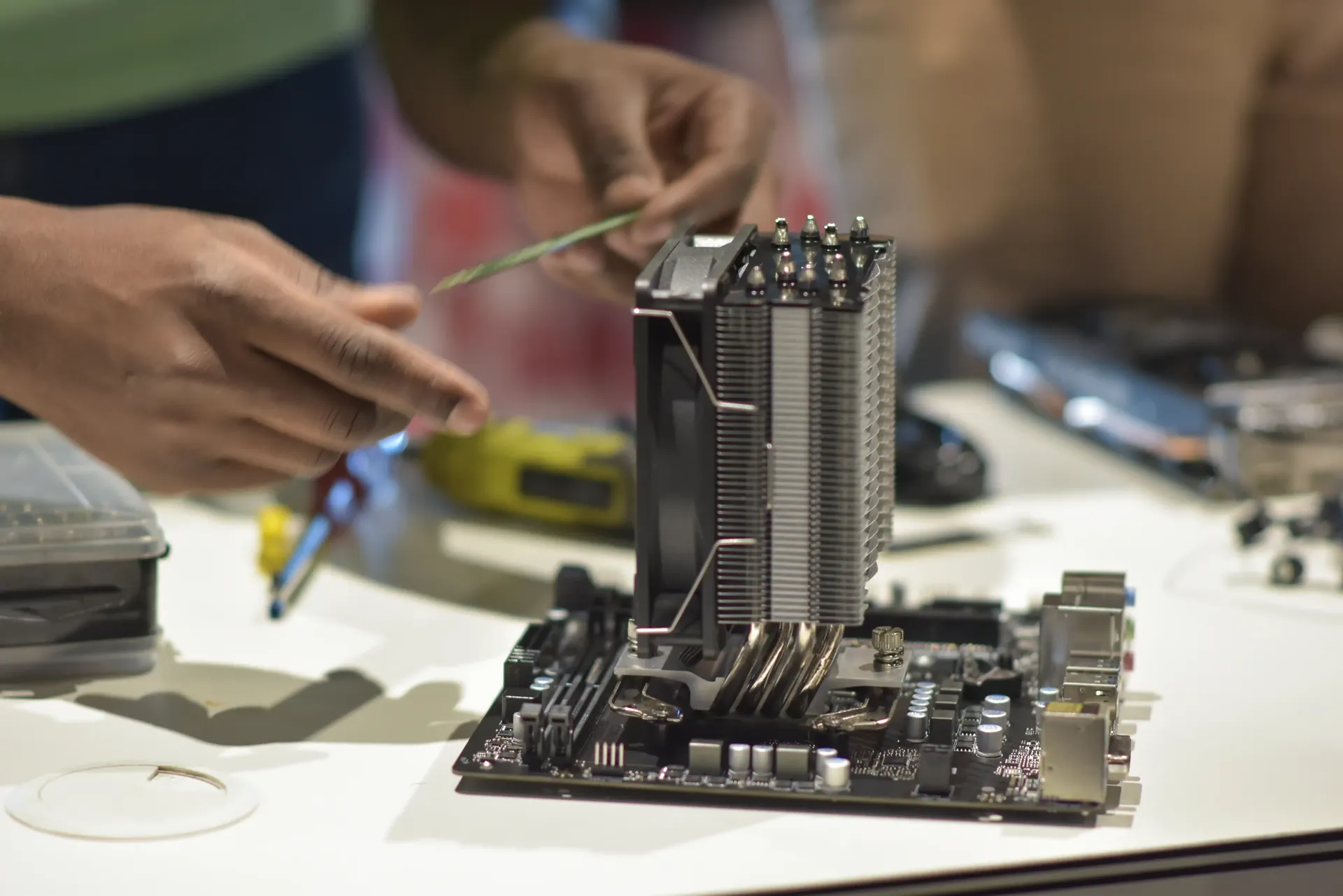 student assembling a computer system